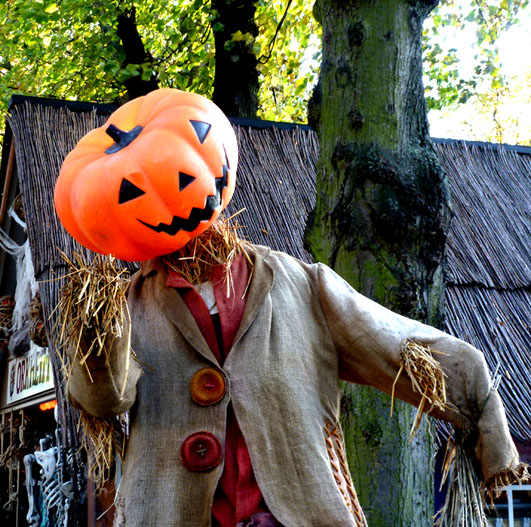 Smiling pumpkin man made of straw