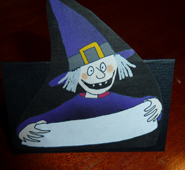 Place card for Halloween witch with sign